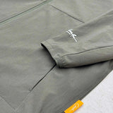 Close-up of Studio By Charles khaki lightweight track jacket sleeve and pocket detail