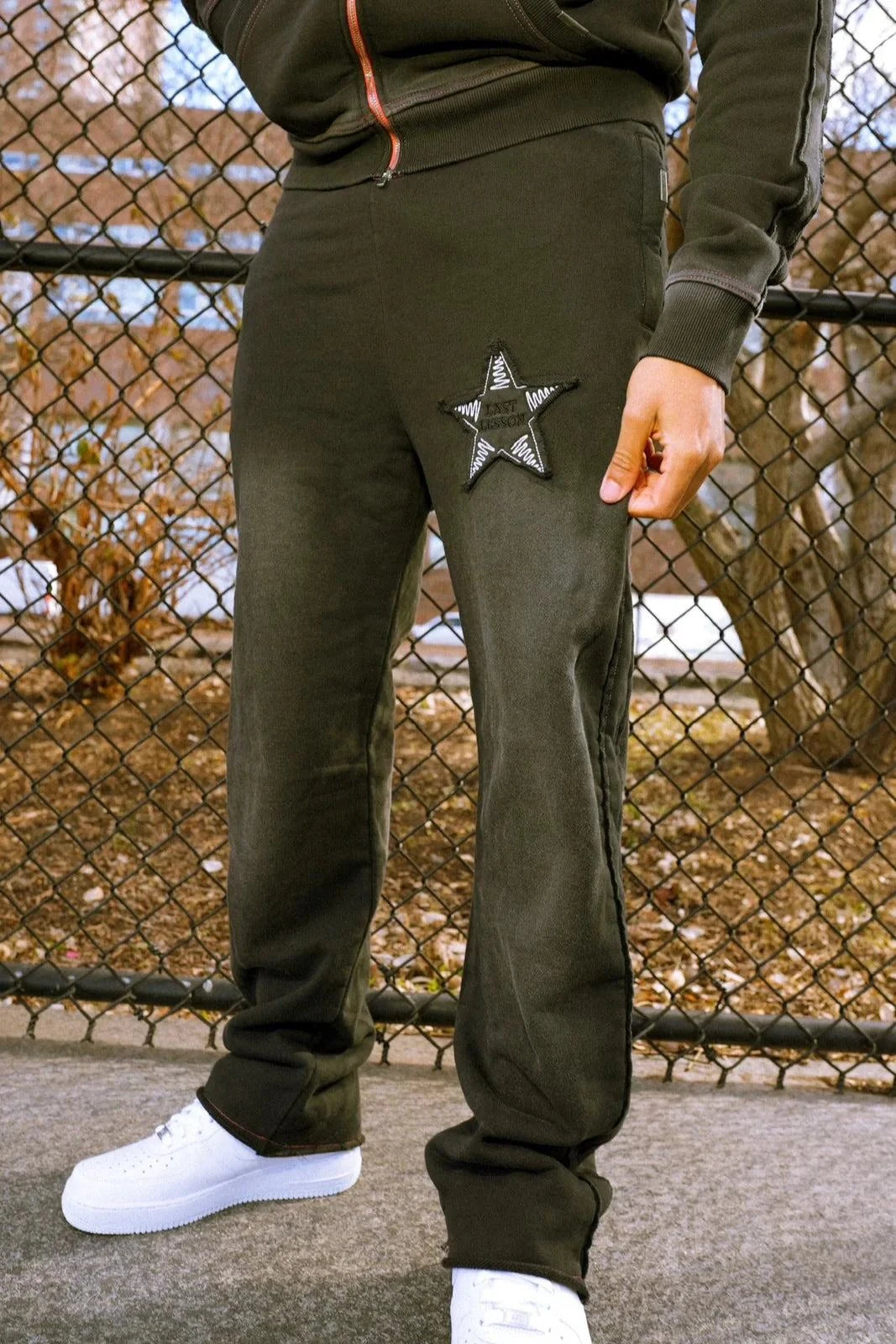 Last Lesson Appliqué Black Joggers with star embroidery design.