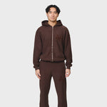 Annie Hood College Zip in washed brown, 500gsm brushback cotton, relaxed fit hoodie with garment dye, modeled by 6'0" male with 31 waist wearing size M