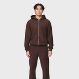 Annie Hood College Zip in washed brown, 500gsm brushback cotton, relaxed fit hoodie with garment dye, modeled by 6'0" male with 31 waist wearing size M