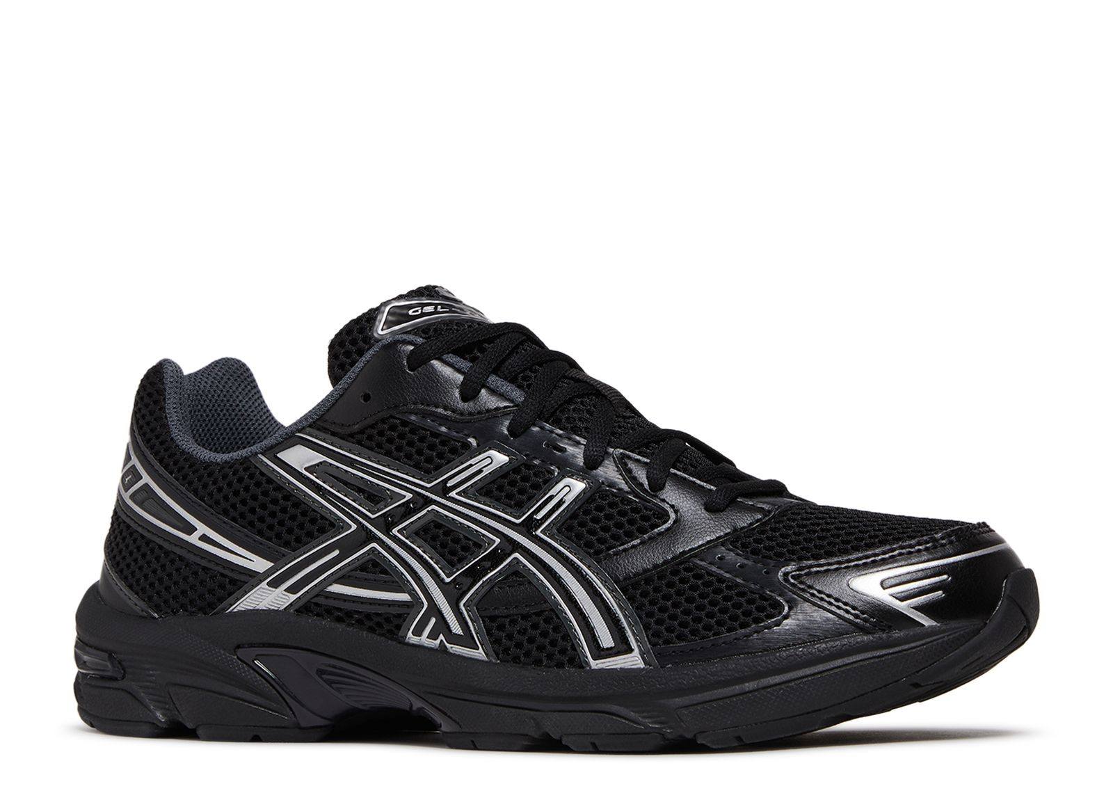 Black Gel 1130 athletic shoe with silver detailing and mesh upper