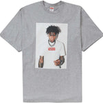 Heather grey Supreme NBA Youngboy Tee featuring a printed image of NBA Youngboy wearing a white Supreme shirt.