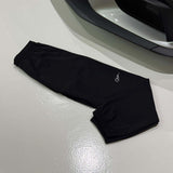 Studio By Charles black Studio Trackpant 2.0 laid flat on white floor near car bumper