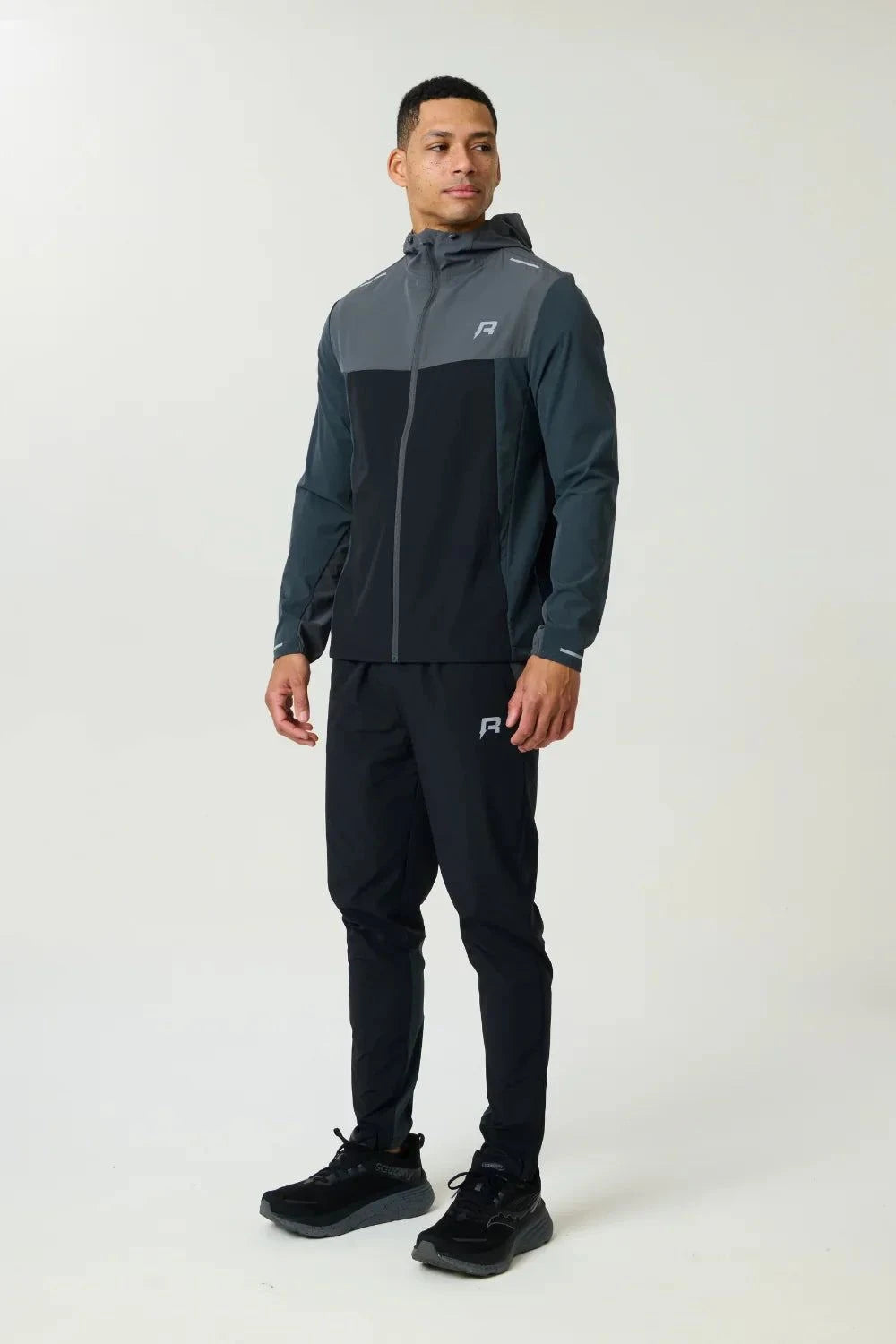 Reprimo Flight Windbreaker in slate and obsidian with lightweight polyamide fabric and zip pockets for weather protection and breathability