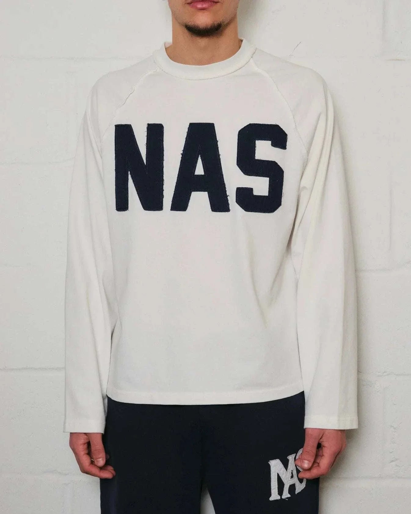 Natural Art Studio white cotton long sleeve sweatshirt with distressed NAS appliqué and boxy fit