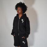 Black Five Questions fleece zip-up hoodie with star and question mark design worn by model