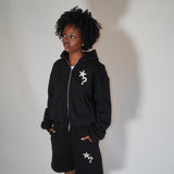 Black Five Questions fleece zip-up hoodie with star and question mark design worn by model