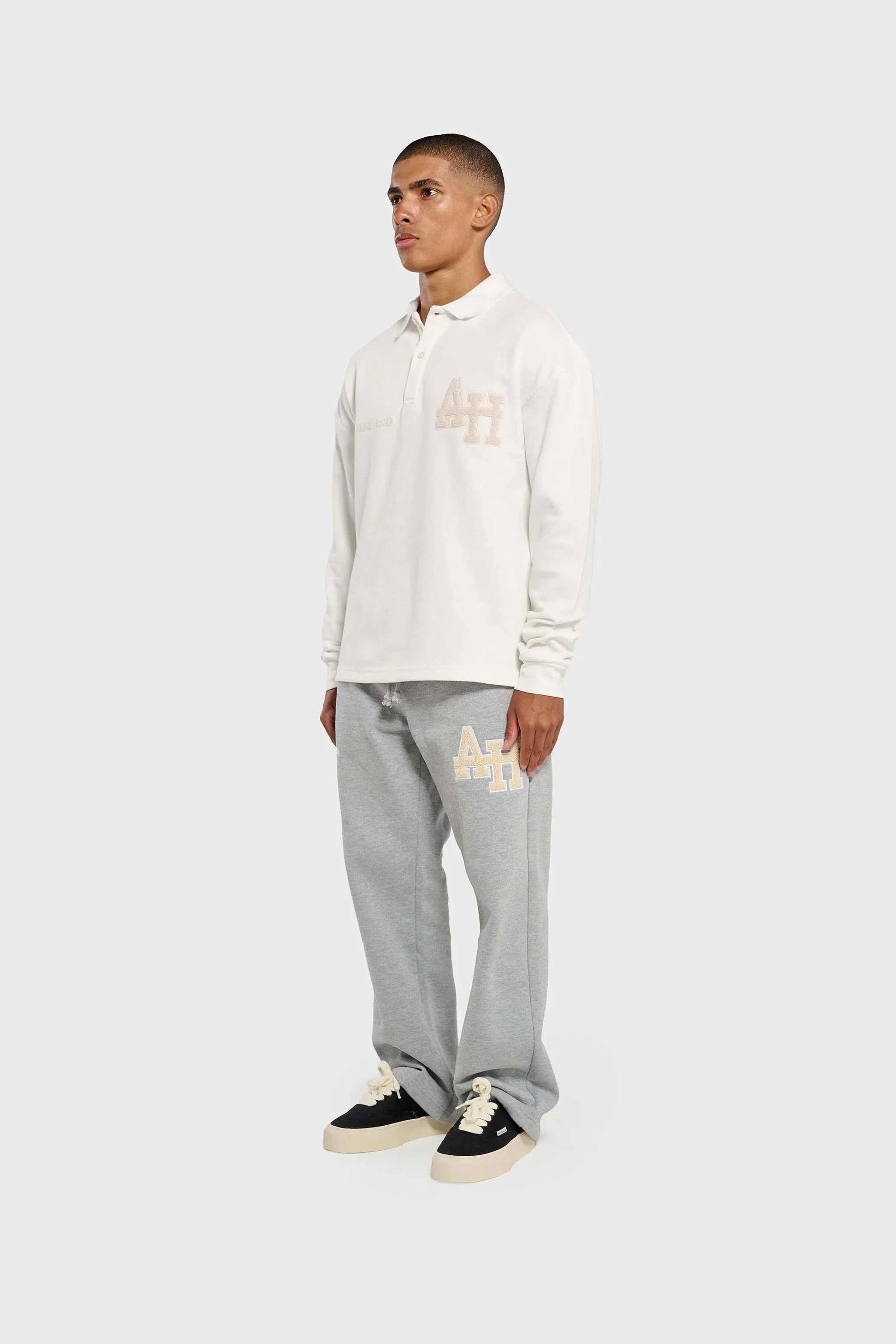 White Annie Hood College polo shirt with double embroidery logo on ribbed cotton fabric