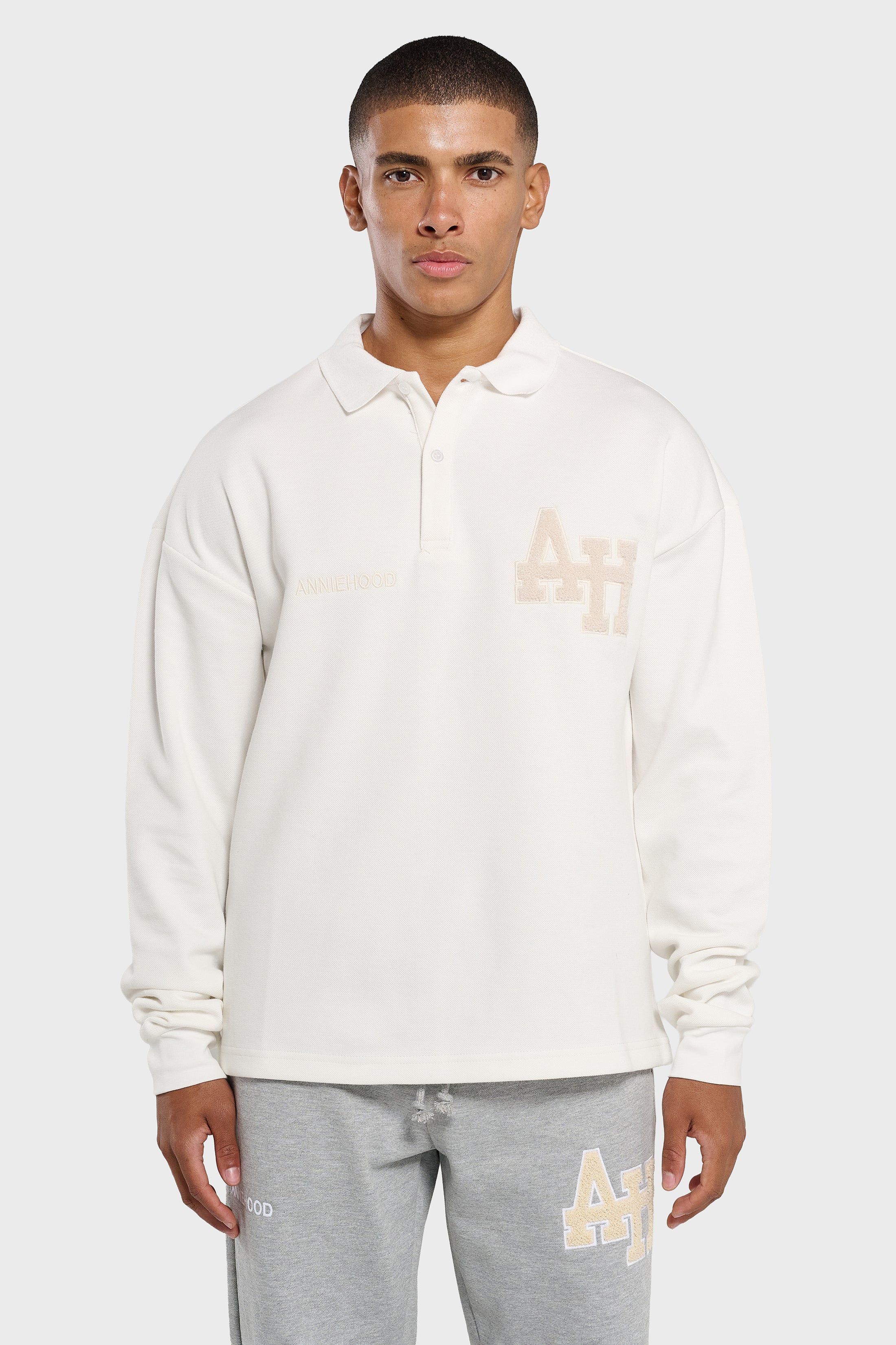 Annie Hood College white polo shirt with double embroidery logo on ribbed cotton