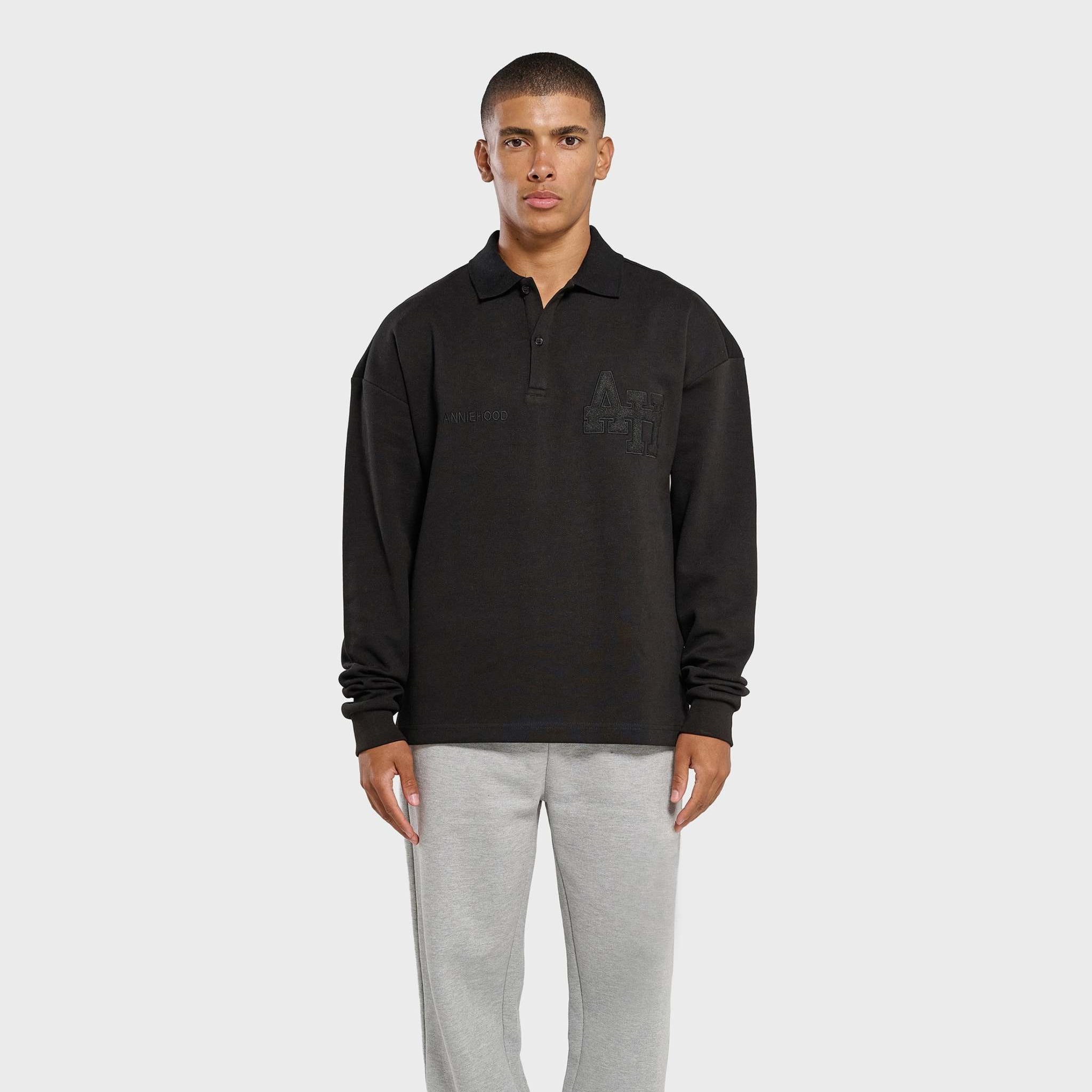 Annie Hood College black polo shirt with double embroidery logo on premium ribbed cotton