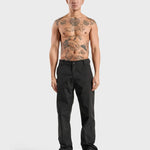 ANNIE HOOD Nylon Track Pants Black, wind and water-resistant with adjustable ankle pull cords, worn by model in size M.