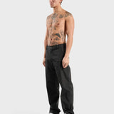 Black ANNIE HOOD nylon track pants, wind and water-resistant, shown cuffed with pull cords.
