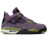 Air Jordan 4 Retro Canyon Purple women's sneaker with purple suede, green eyelets, and black accents.