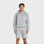 Man wearing grey ANNIE HOOD College Zip hoodie with dropped shoulder and double embroidery logo, paired with matching shorts