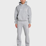Model wearing grey ANNIE HOOD College Hoody with dropped shoulder and double embroidery logo, paired with matching joggers