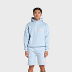 Man wearing baby blue ANNIE HOOD College Hoody with dropped shoulder and double embroidery logo
