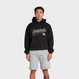 Man wearing black ANNIE HOOD Baseball Hoody with dropped shoulder and double embroidery logo