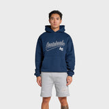Man wearing navy ANNIE HOOD Baseball Hoody with dropped shoulder and double embroidery logo