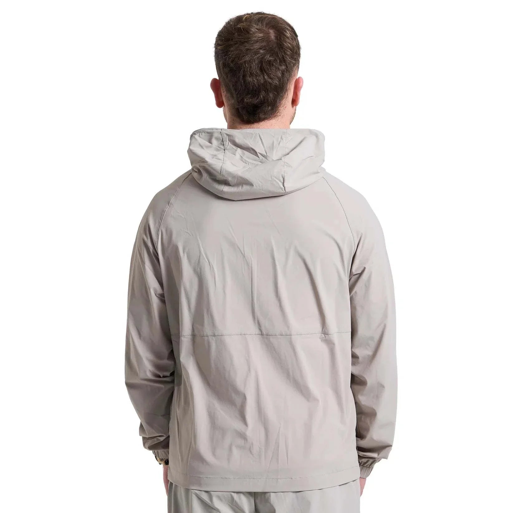 Back view of man wearing grey Attain Active Track jacket with hood