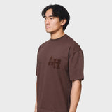Annie Hood College T-shirt in washed brown with relaxed fit, made from 280gsm cotton, worn by 6'0 model in size M