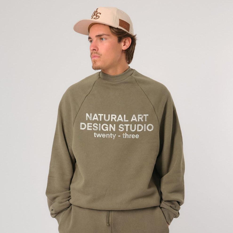 Natural Art Studio vintage green wash sweatshirt with faded screen print and raglan seams