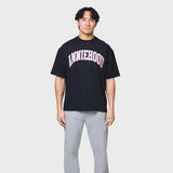 Navy ANNIE HOOD COLLEGE relaxed fit cotton t-shirt worn by 6'0" model in medium size