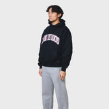 Navy ANNIE HOOD COLLEGE arch hoody in relaxed fit, 500gsm brushback cotton, worn by 6'0 model