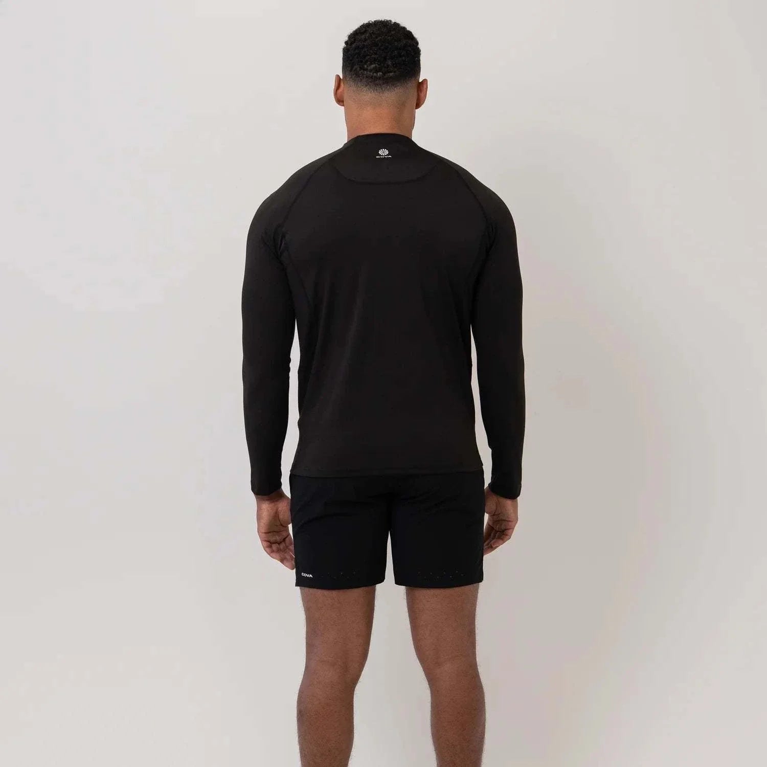 Cova Daily black quarter zip long sleeve top back view on male model