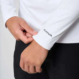 Close-up of Cova Daily Quarter Zip white long sleeve with logo on cuff