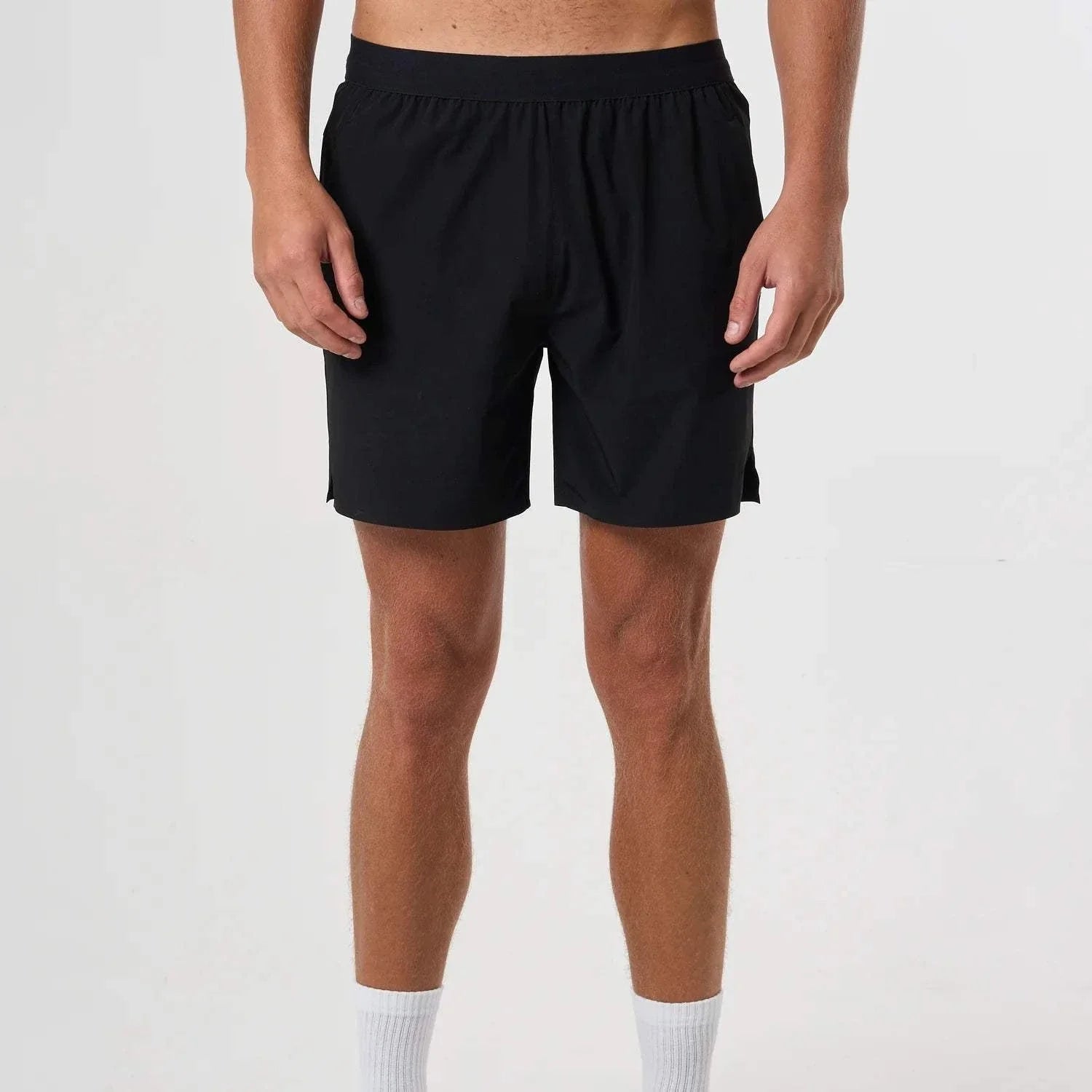 Black Cova Daily Shorts worn by male model with elastic waistband and relaxed fit