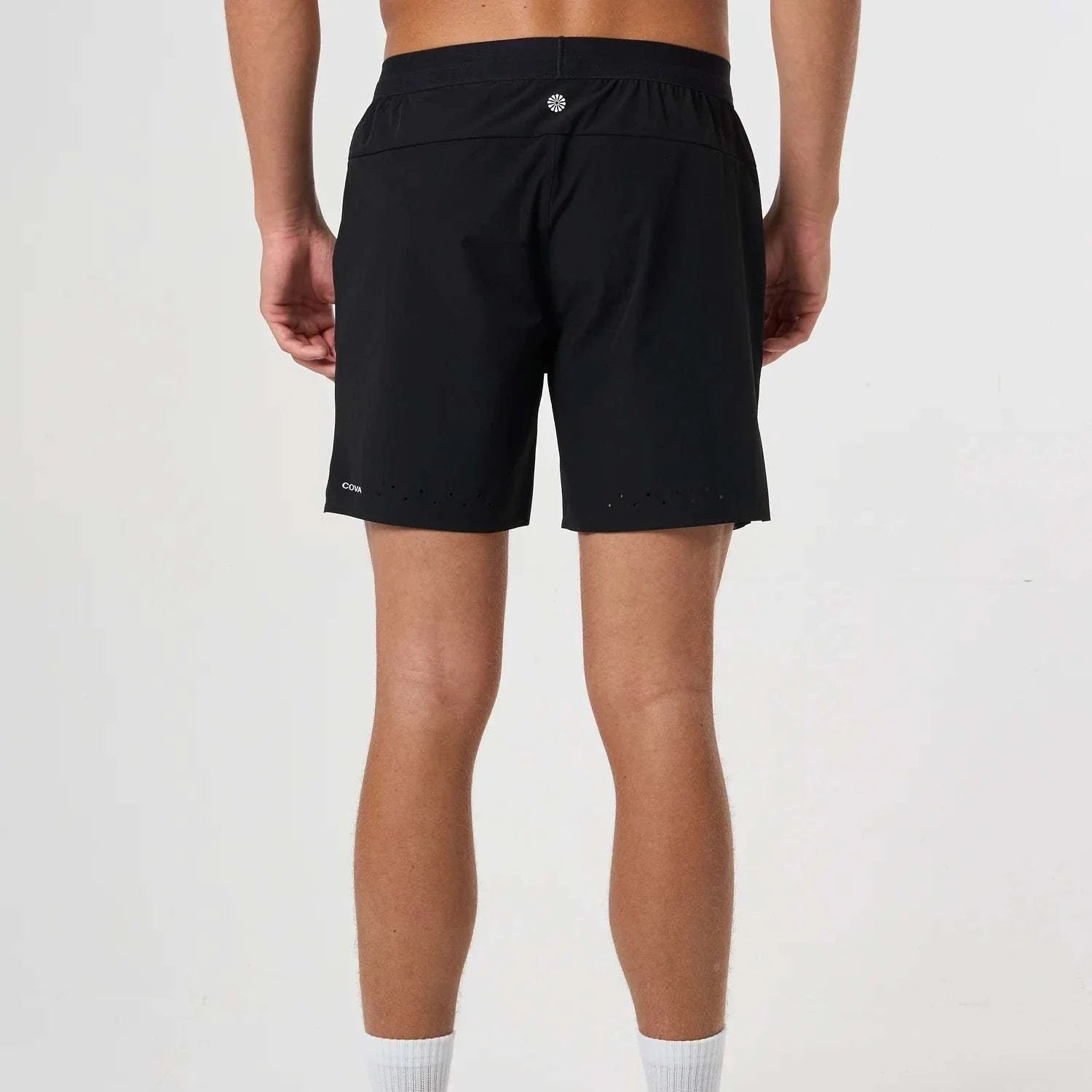 Back view of man wearing black Cova Daily Shorts