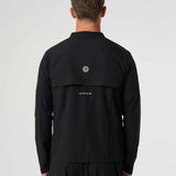 Back view of man wearing black Cova Daily Track Jacket with logo on upper back