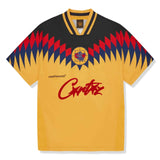 CORTEIZ CLUB yellow football jersey with geometric design and logo.