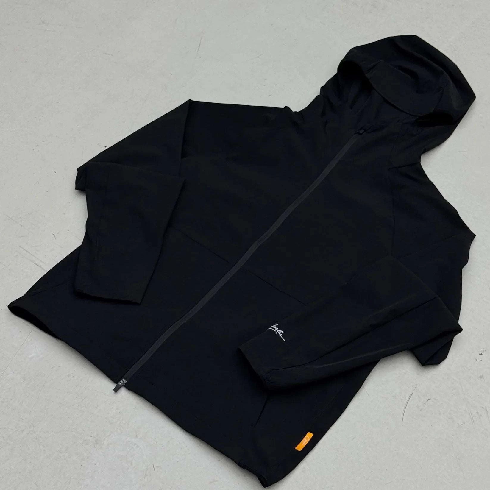 Studio By Charles Black black track jacket with hood and zipper closure laid flat