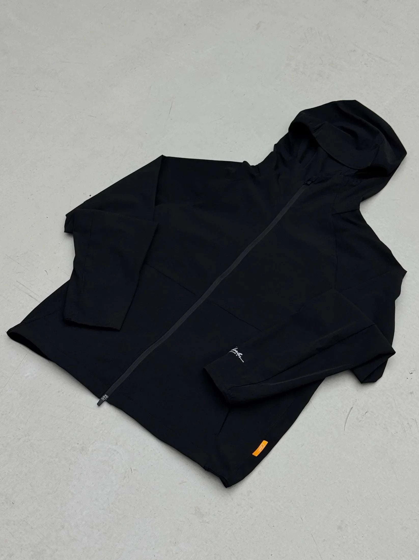 Studio By Charles Black black track jacket with hood and zipper closure laid flat