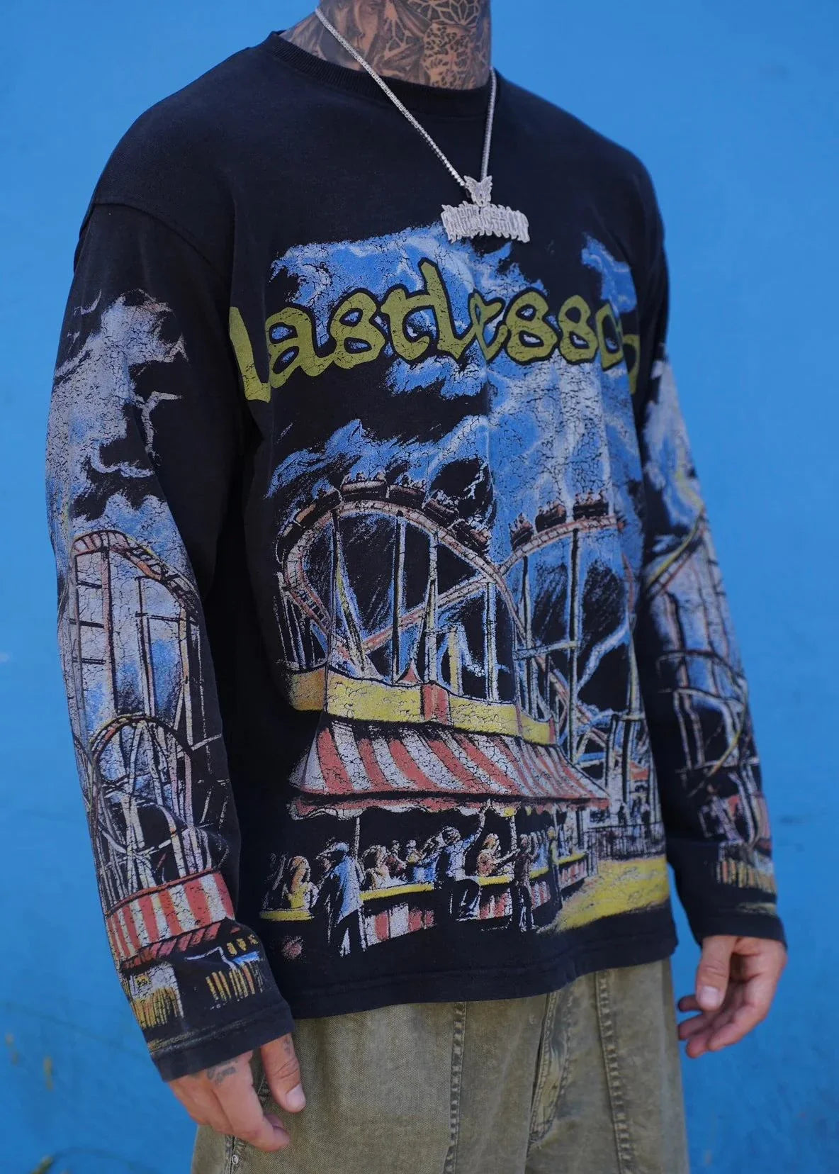 Last Lesson Carnival T-Shirt featuring vibrant carnival design with Ferris wheel graphics.