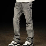 Siarr Flared Jeans Triple Grey with open hem and branded rivet buttons on model