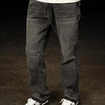 Siarr Flared Jeans washed black denim with open hem and branded rivet buttons
