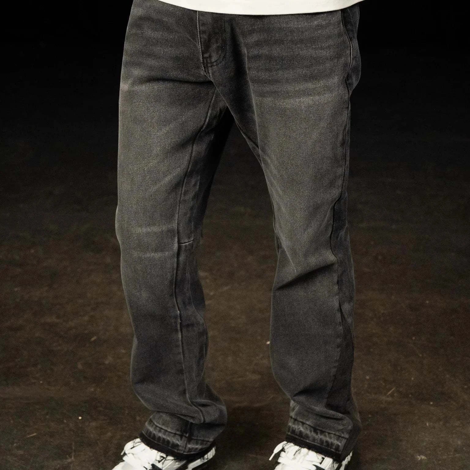 Siarr Flared Jeans washed black denim with open hem and branded rivet buttons