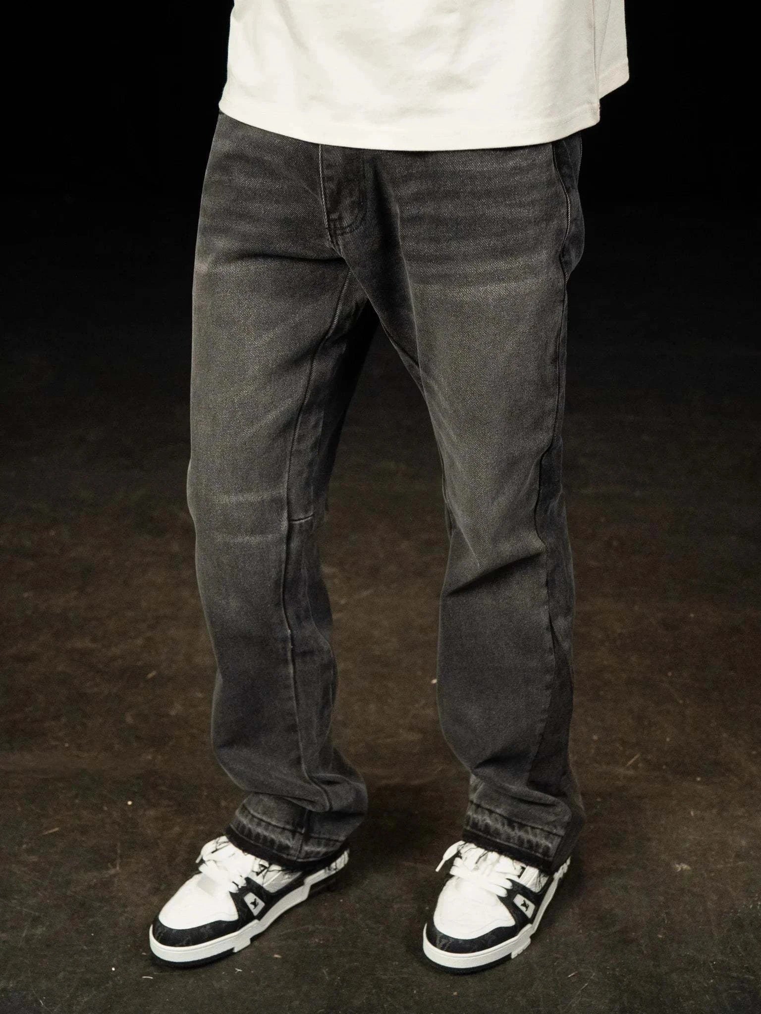 Siarr Flared Jeans washed black denim with open hem and branded rivet buttons