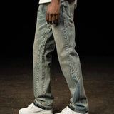 Siarr Flared Jeans in dusty blue denim with open hem and branded rivet buttons