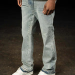 Siarr Flared Jeans in triple blue denim with open hem and branded rivet buttons