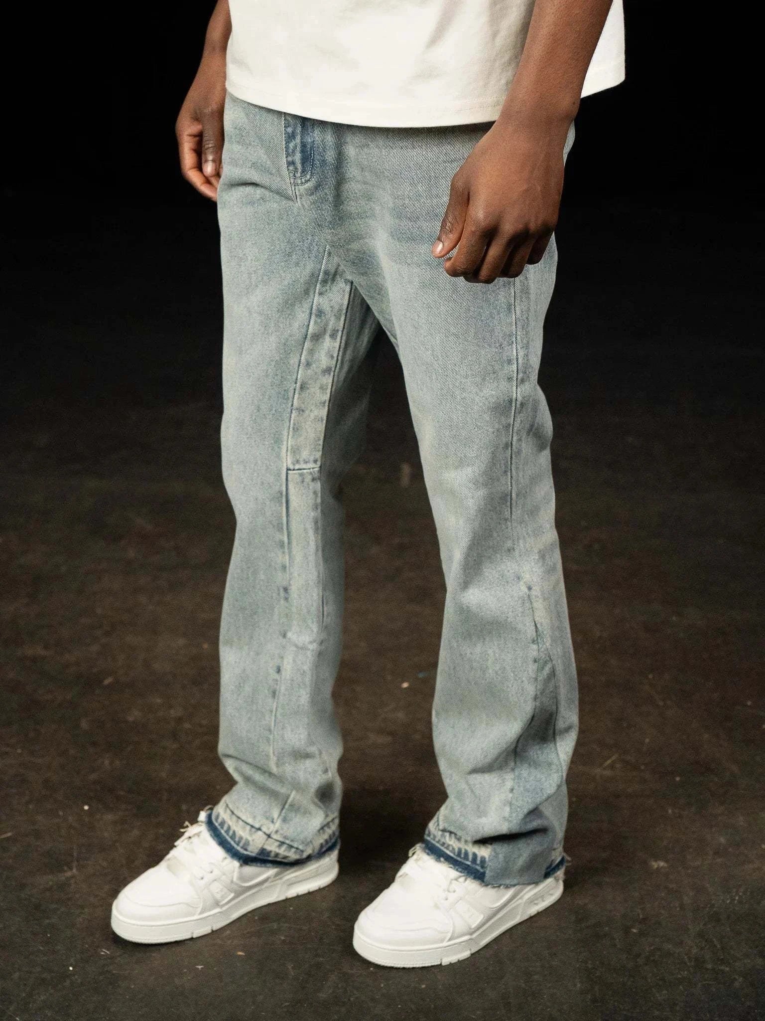 Siarr Flared Jeans in triple blue denim with open hem and branded rivet buttons