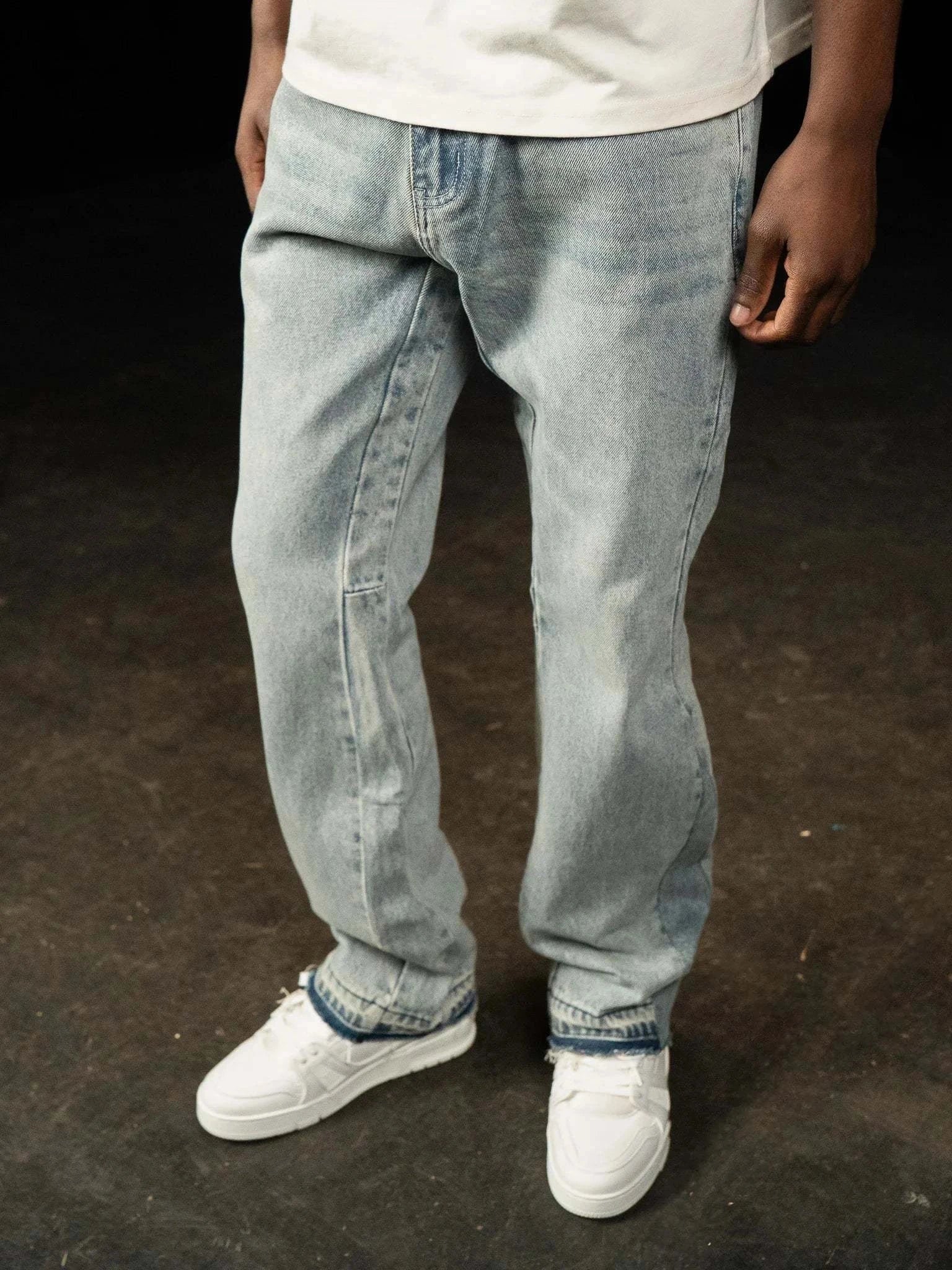 Siarr Flared Jeans in triple blue denim with flared fit and open hem worn by model