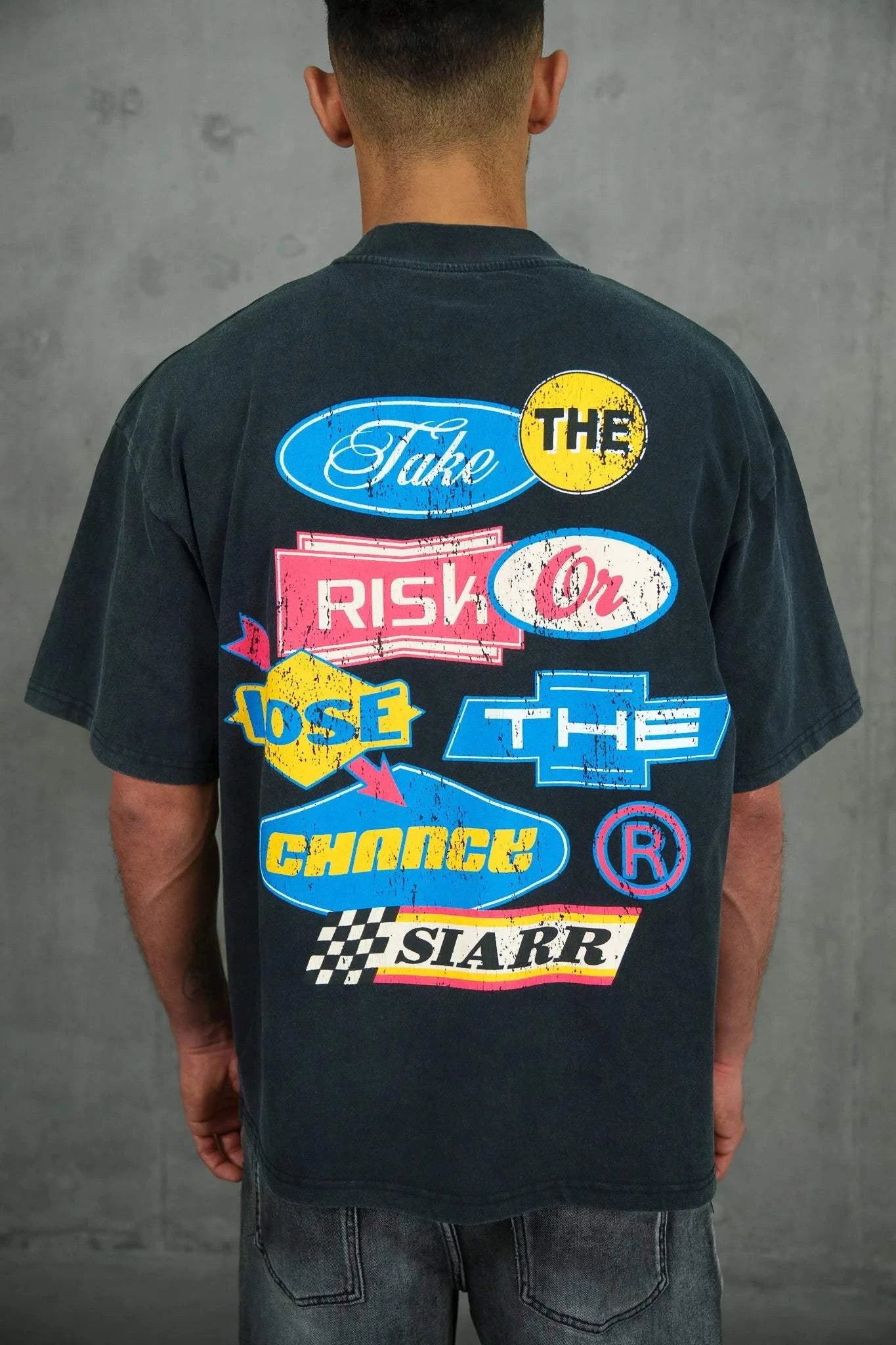 Siarr Take The Risk Tee vintage black relaxed fit graphic t-shirt with bold back print and distressed detailing
