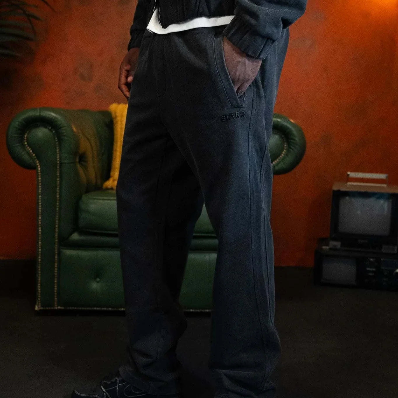 Siarr Panelled Joggers in washed black with regular fit, straight leg, elasticated waistband, and slit pockets.