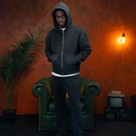 Man wearing Siarr Washed Piping Joggers in washed black with elasticated waistband and slit pockets