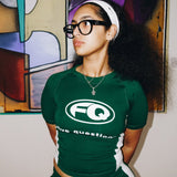 Five Questions Ladies FQ green baby tee worn by woman with glasses and headband