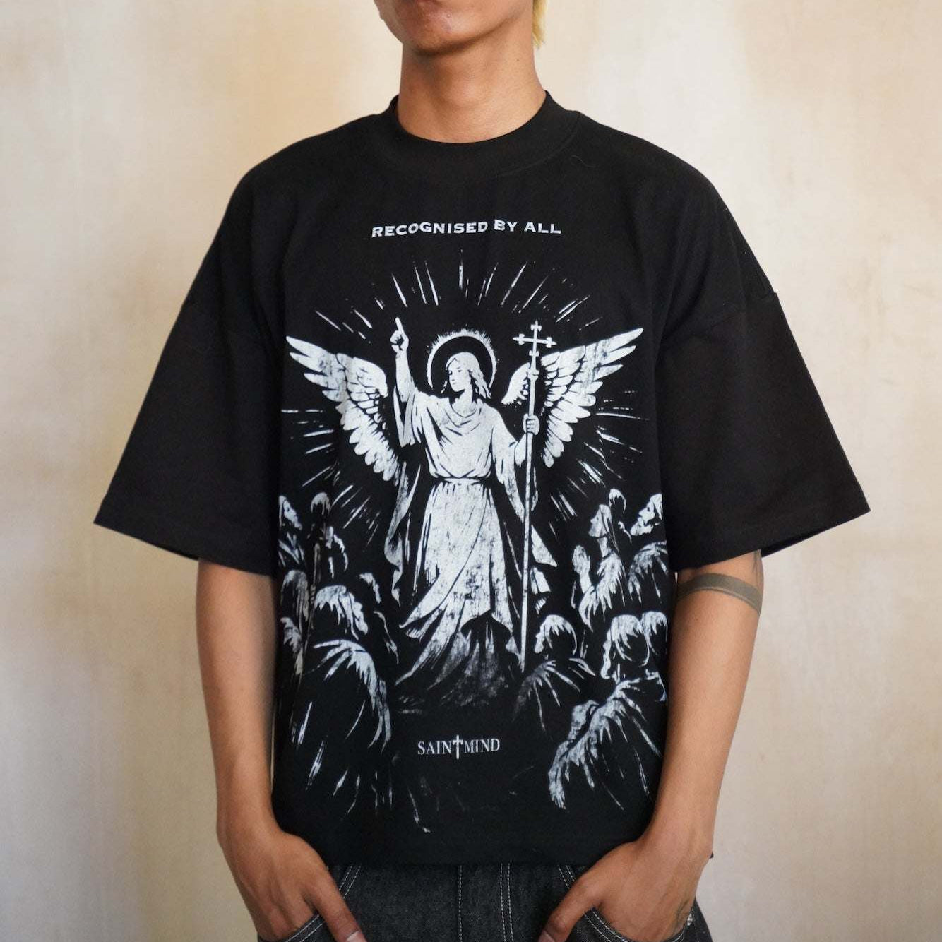 Saint Mind black oversized boxy fit T-shirt with printed logo, 100% cotton, 280gsm, modeled by 5ft10 male, size medium