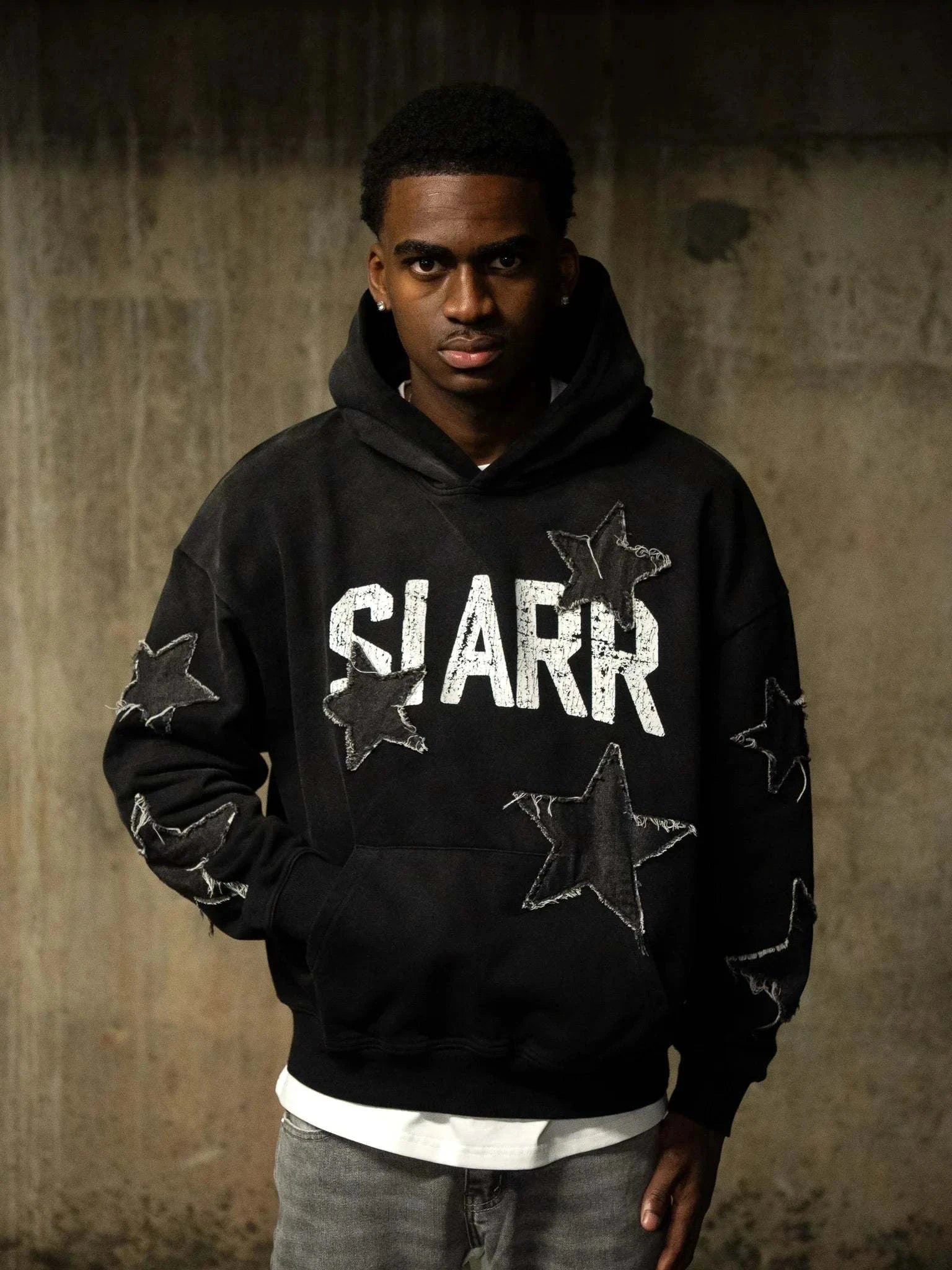 Siarr Star Hoodie washed black pullover with kangaroo pocket and matching ribbing in 100% cotton